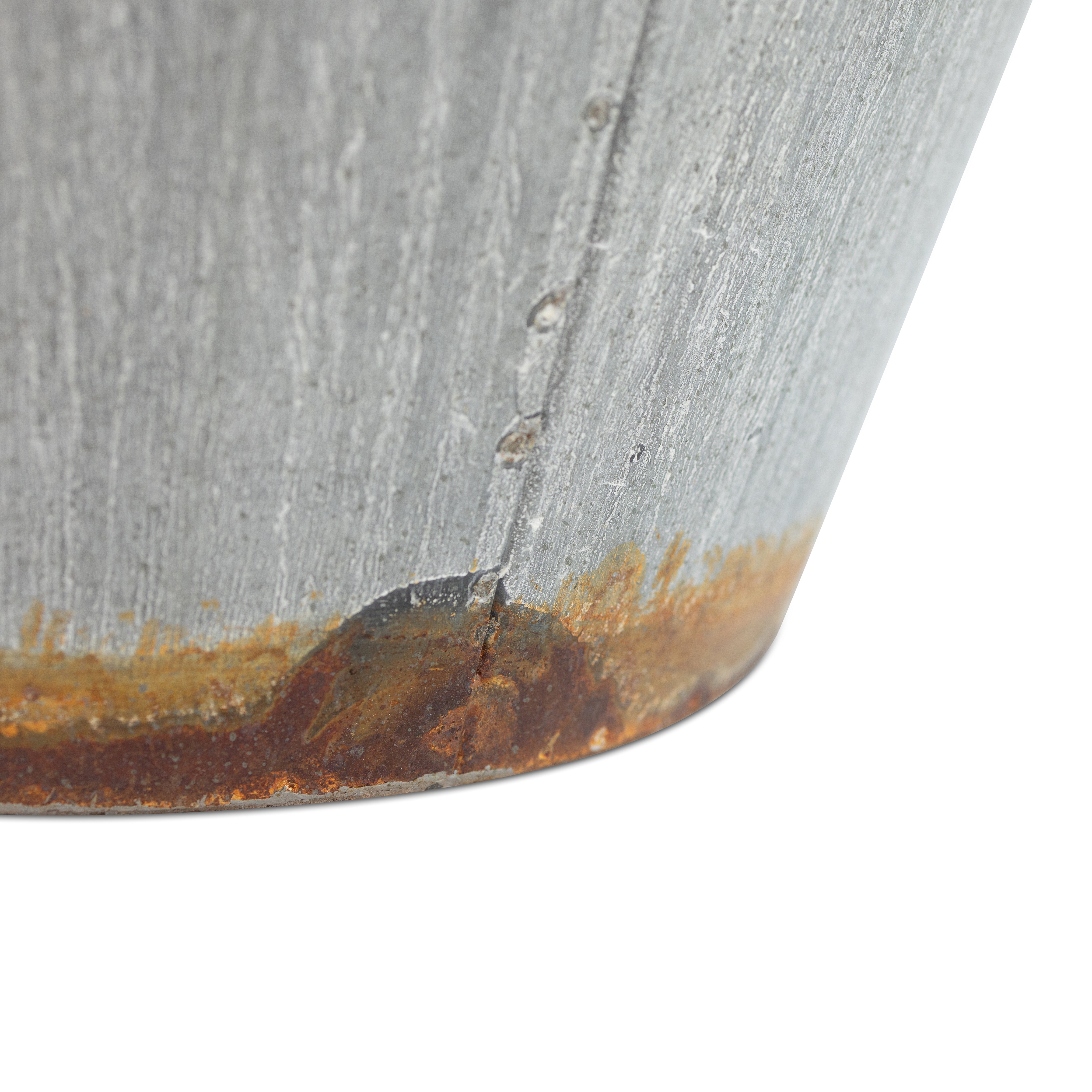 bottom view close up of the galvanized tapered steel planter showing the details of the the distressed finish on a white background