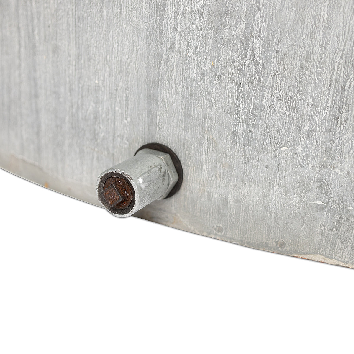 Close-up of drain plug of the rustic oval water trough planter with a weathered finish and a distinctive rust-toned band, showcasing classic farmhouse charm on a white background.