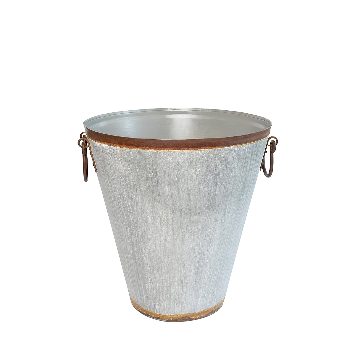 A galvanized tapered steel planter with a distressed finish and sturdy ring handles, inspired by French grape harvesting baskets.