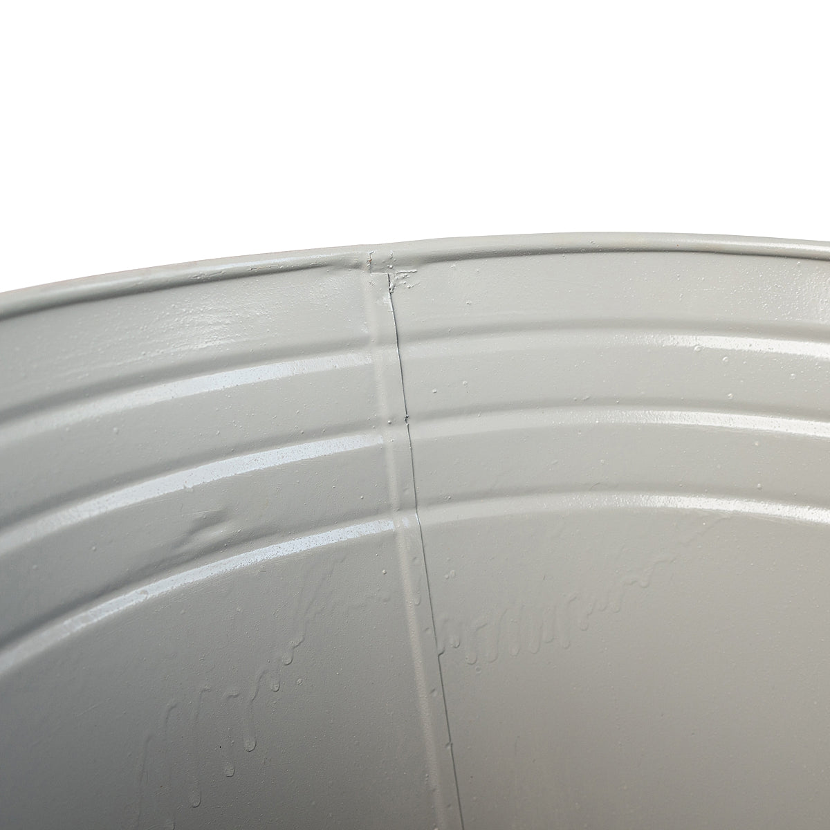 Close-up of inside coating on the Tall Weathered Whitewash Steel Planter showcasing the color and seams on a white background.