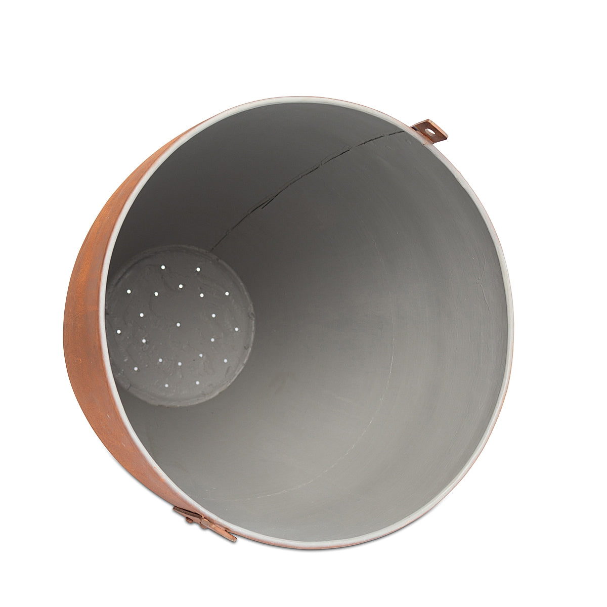 Inside and laying down view of the Aged Round Ore Bucket Steel Planter with a rich aged rust patina finish, inspired by rugged, vintage ore buckets showcasing the drain holes on a white background.