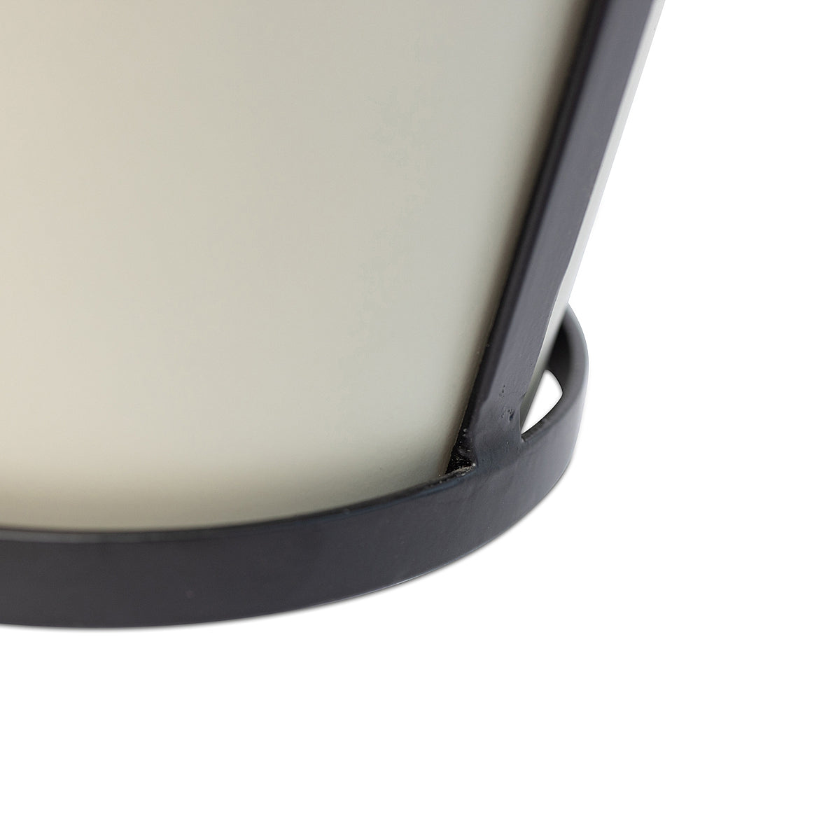 Close-up detail of the bottom of the off-white modern rustic framed steel planter showing the construction and black metal frame