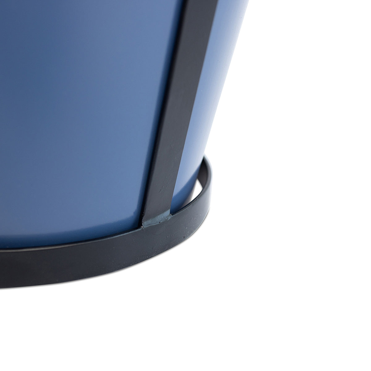 Close-up detail of the bottom of the blue modern rustic framed steel planter showing the construction and black metal frame